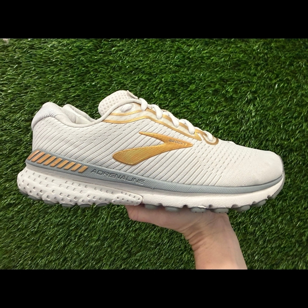 Brooks Women’s White Running Shoe with Gold Accents